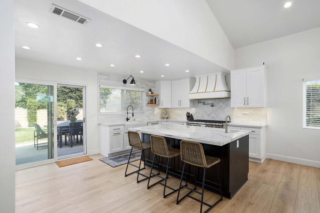 Kitchen island beneath a vaulted ceiling in the Torrance remodel, South Bay
