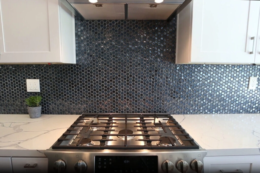 Tile backsplash and gas cooktop detail in an Agoura Hills kitchen remodel