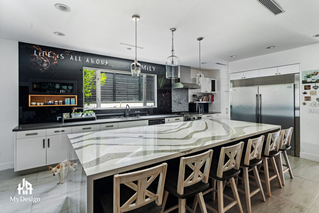 Long kitchen island with bar seating in the West Hills kitchen project, by a licensed general contractor