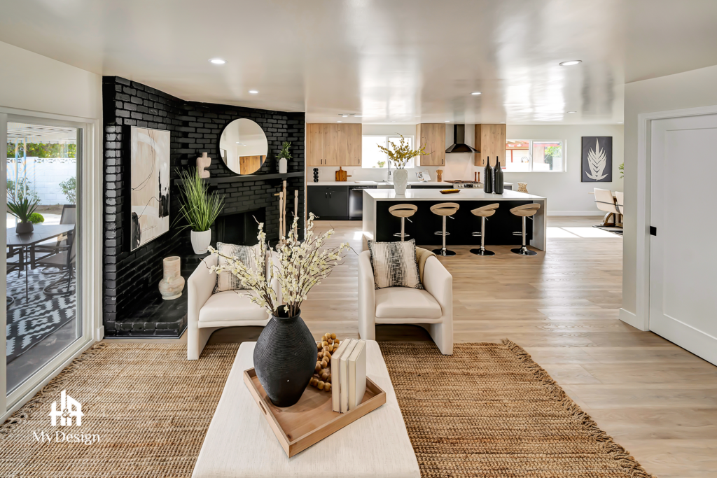Open living area with black brick fireplace in the LA County whole-home project