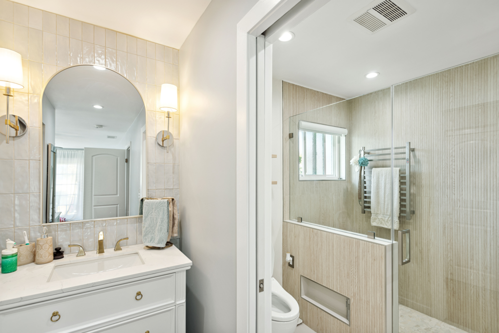 Remodelled bathroom with walk-in shower in a San Pedro home renovation