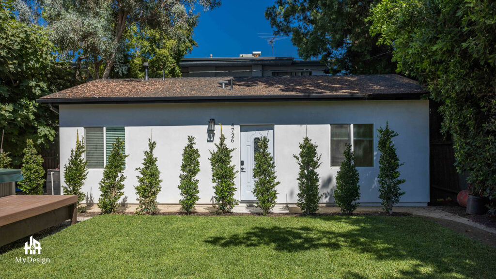 Modern home construction detached unit behind hedging in Sherman Oaks