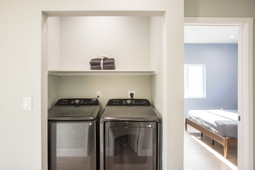 Laundry and bedroom in the Los Alimos home