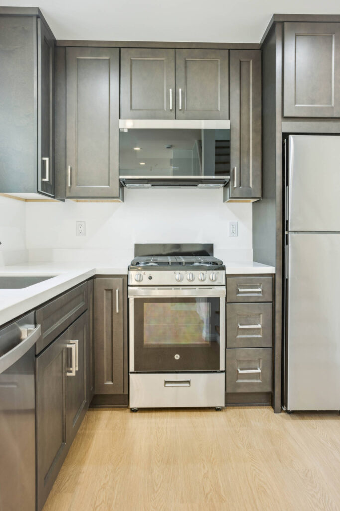 Kitchen with dark grey cabinets and gas range in the Culver City garage conversion ADU