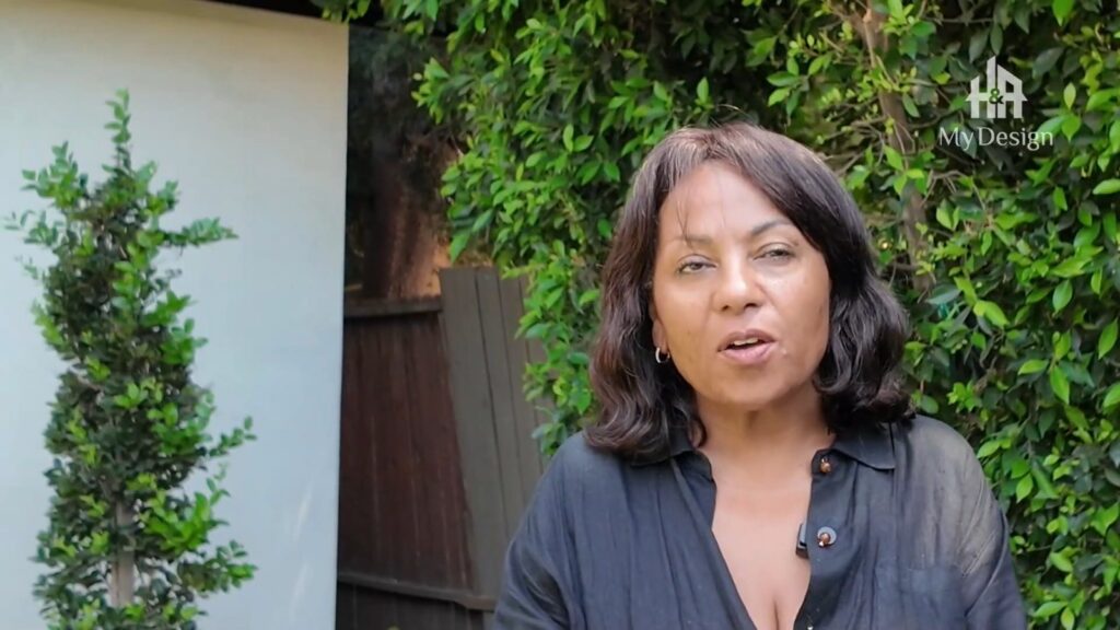 Homeowner speaking on camera outside her completed ADU in Los Angeles