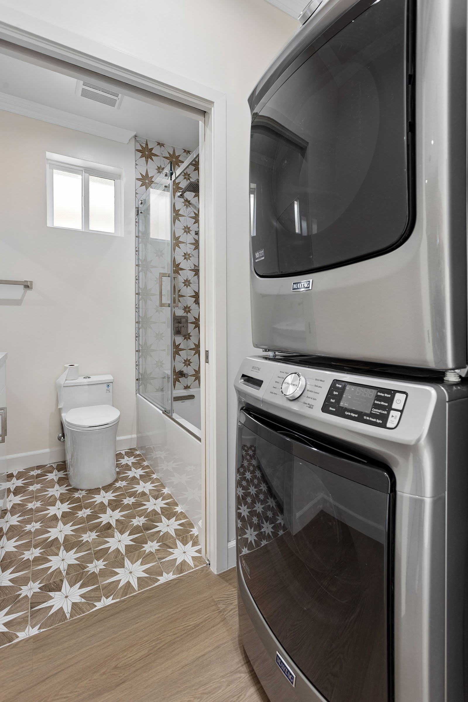 ADU bathroom tub and shower finished in patterned tile