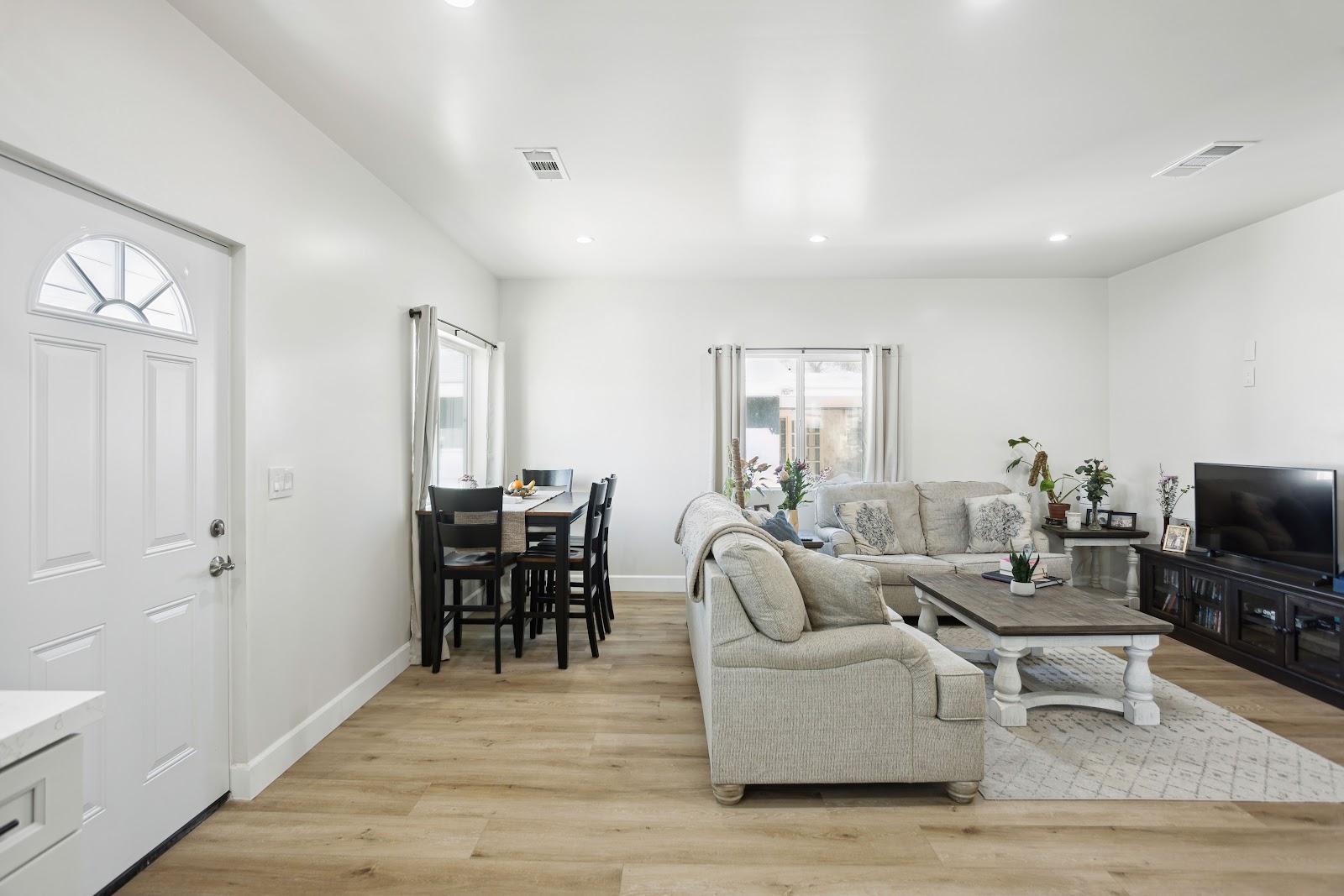 ADU living room with an open plan layout and daylight from two windows