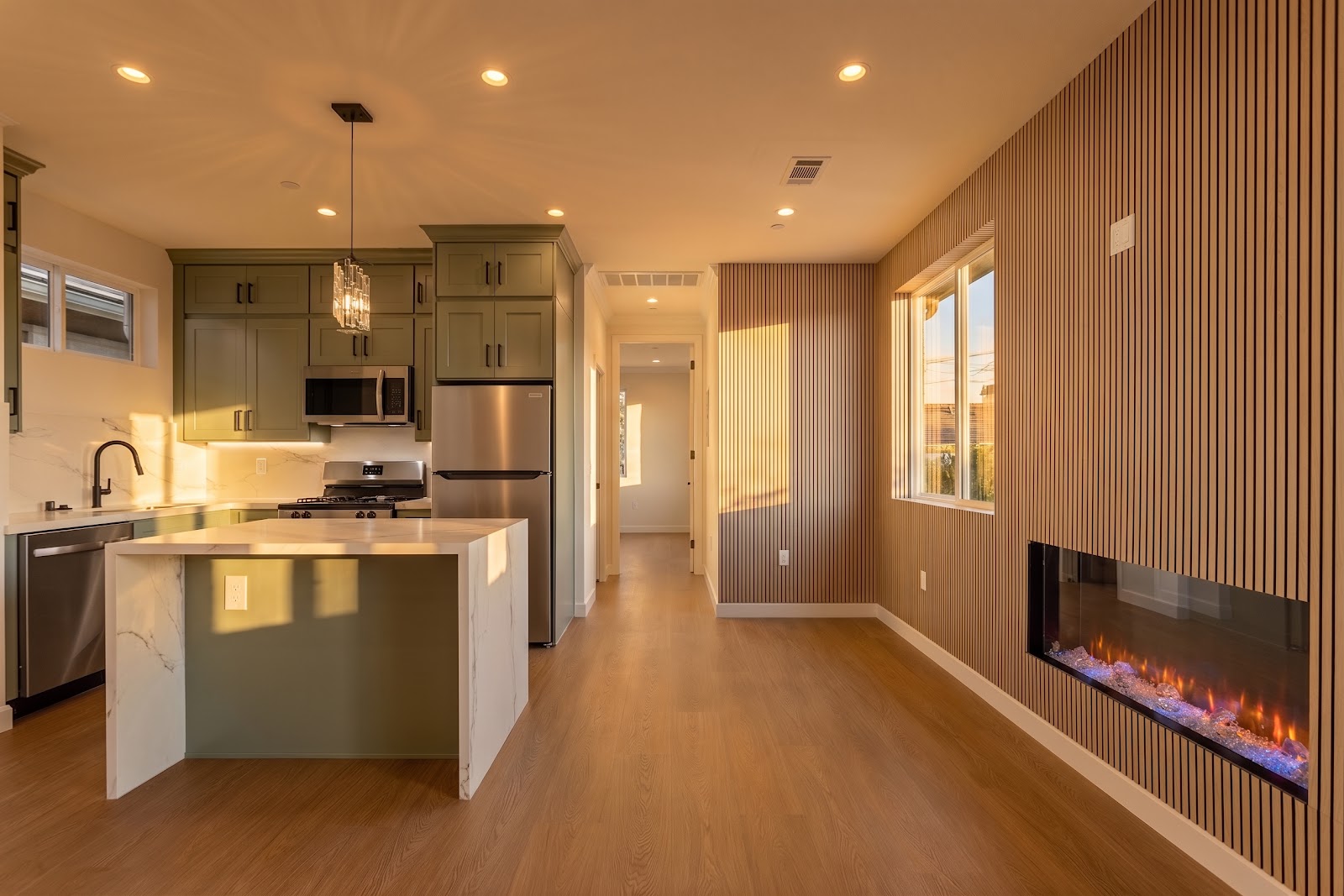 ADU living space in the evening with a linear electric fireplace lit