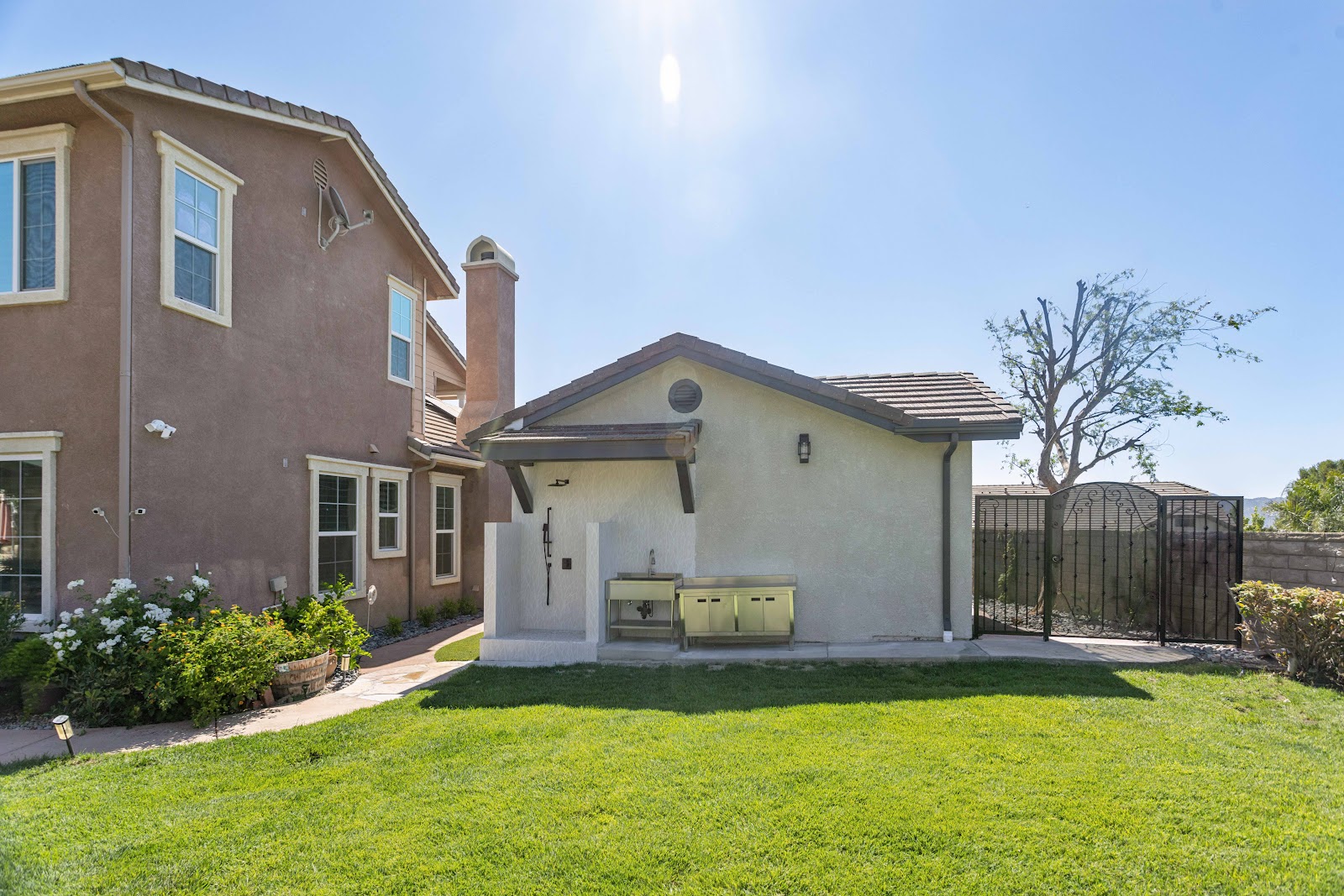 Backyard ADU with gated side access separate from the main house