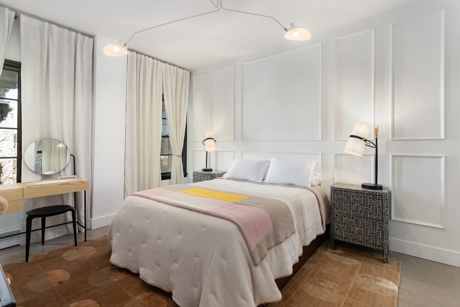 Bedroom remodel with applied wall panelling and a parquet wood floor