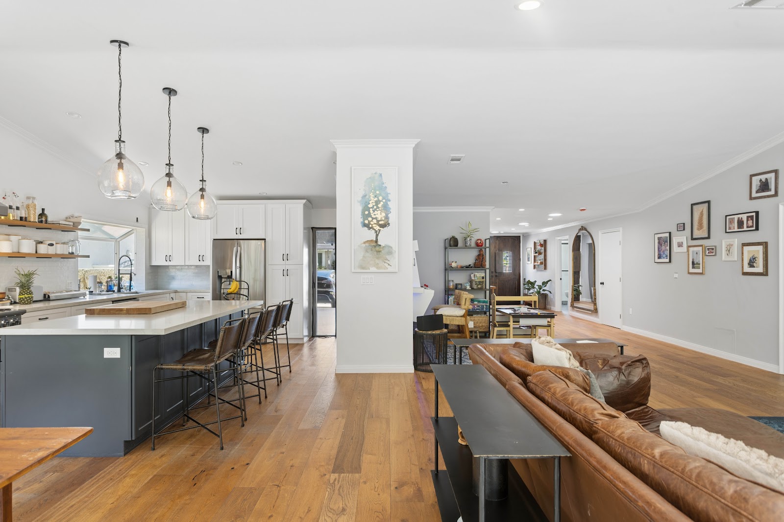 Open plan living and kitchen with a structural column left exposed