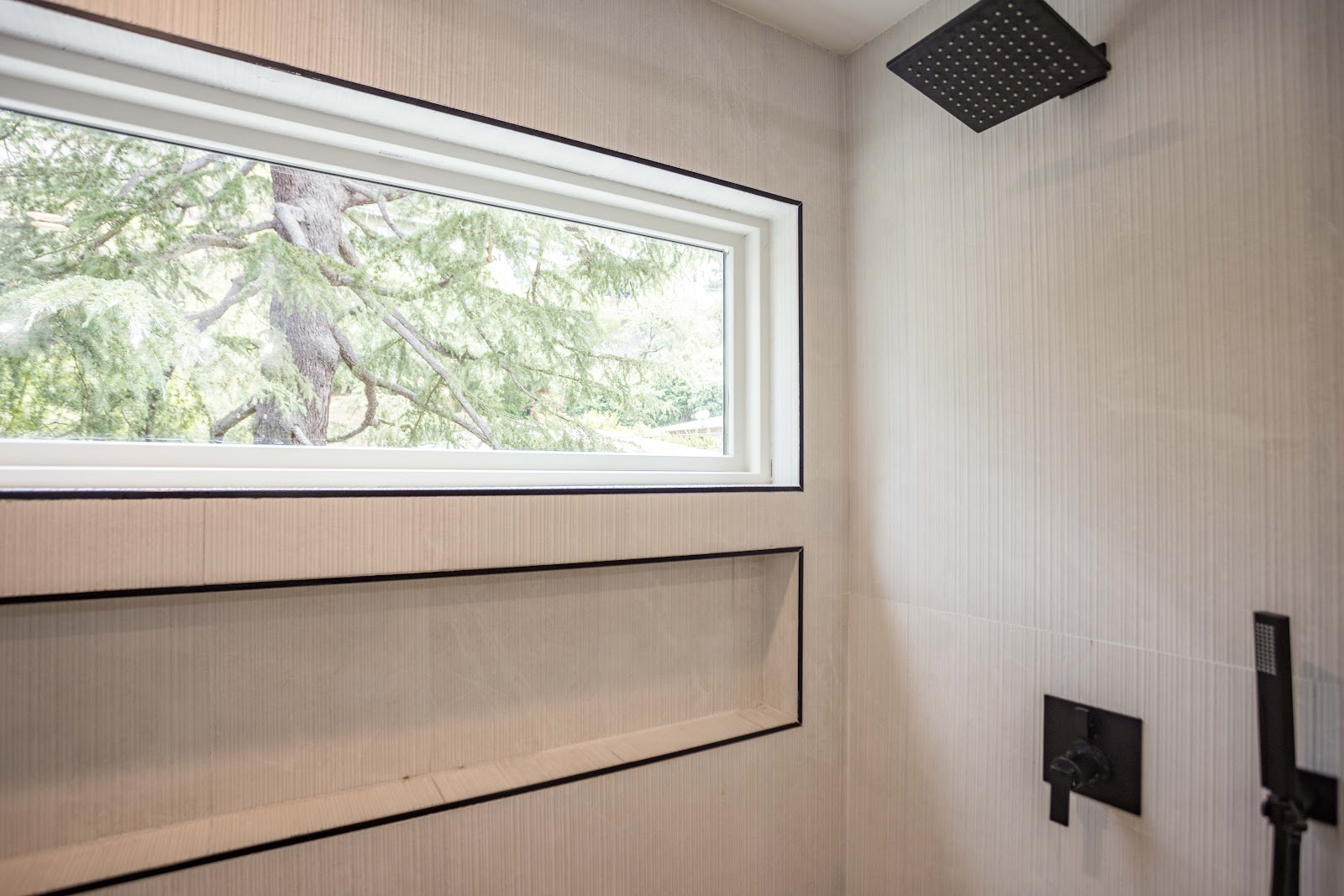 Undermount sink with a matte black widespread faucet